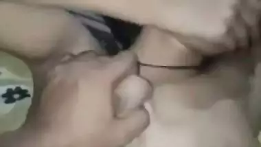 Guy squeezes a 19-year-old nude girl’s juicy boobs